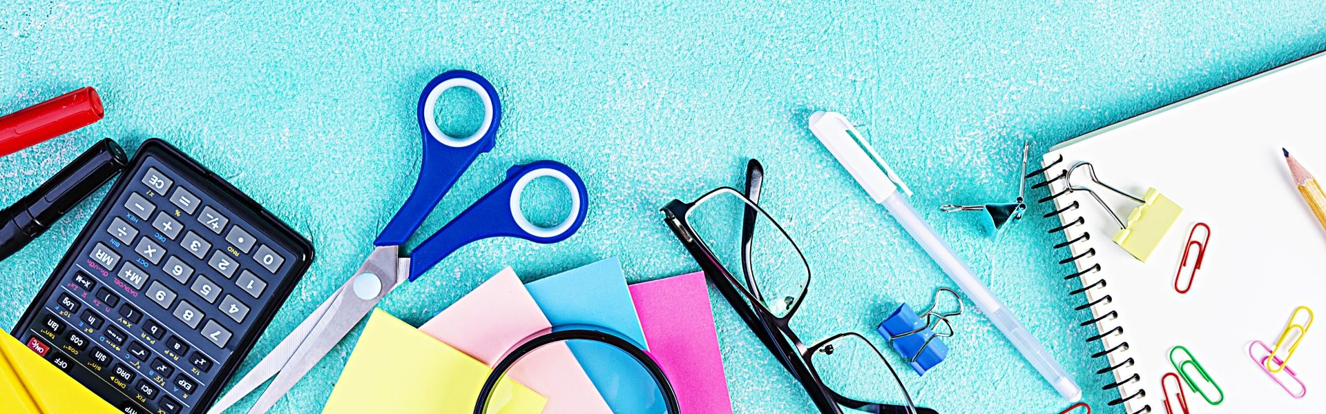 Different school supplies on blue background. Concept Back to school